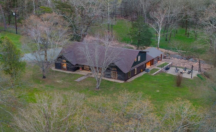 Aerial view of Creekside Ranch cabin and its private creek in Pine Hills West, Broken Bow, OK